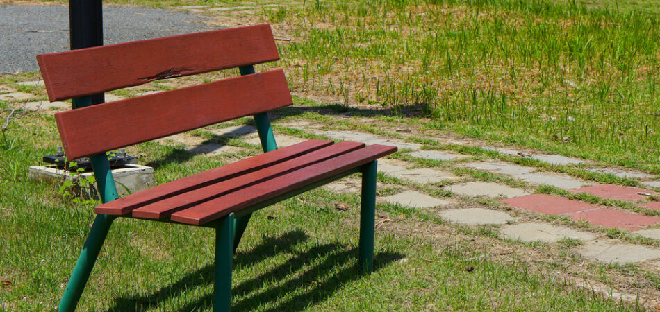 Decorative,bench,in,public,area.,grass,background.